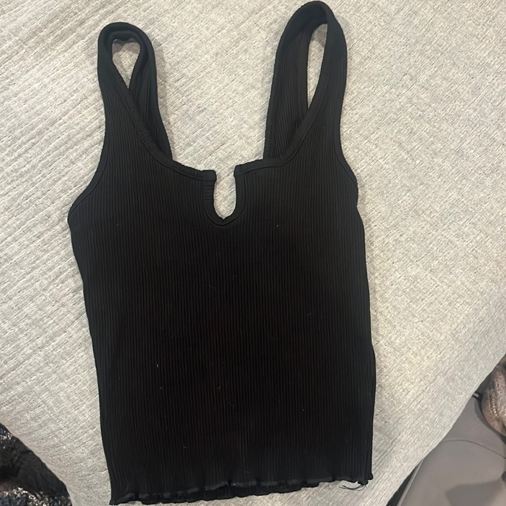 plain black tank top with mini “V” in the middle